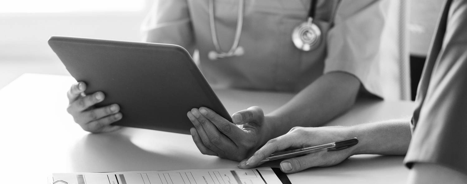 Business Solutions. Veterinarian reviewing MWI Animal Health Practice Management Technology Software