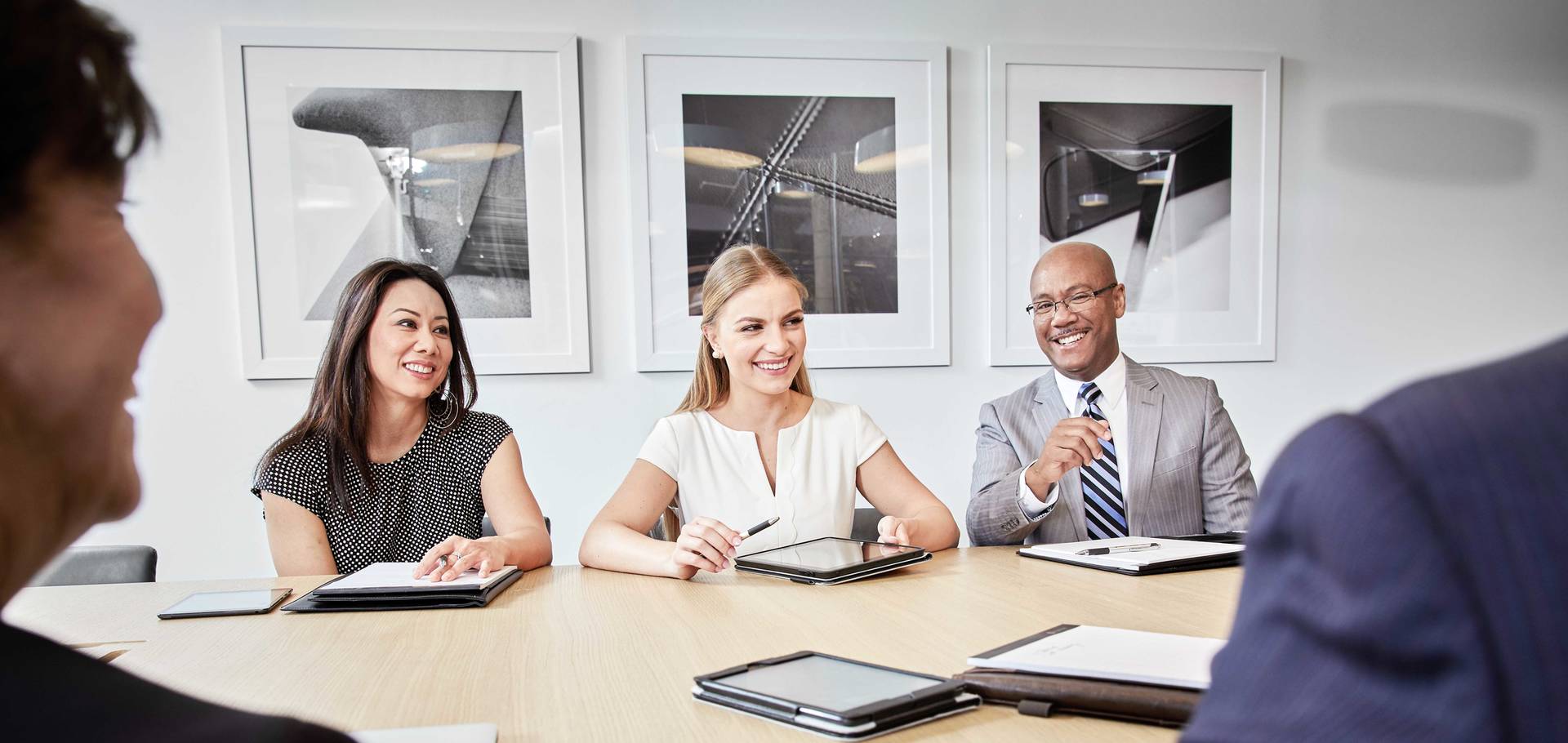 Group of people in business meeting smiling