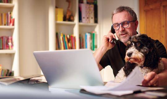 Man working from home with his dog