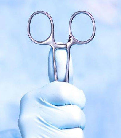 Surgical hand holding scissors with a pit in it
